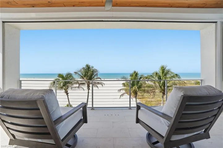 Balcony with view of water and beach - Virtually Edited Image