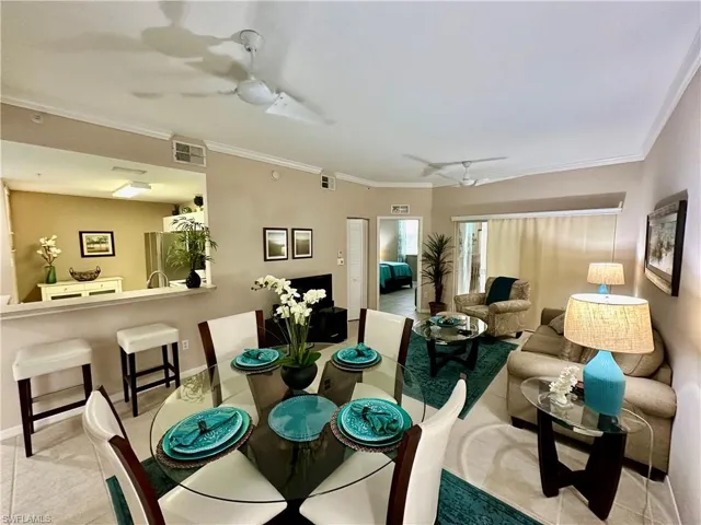 Dining area featuring ornamental molding and ceiling fan