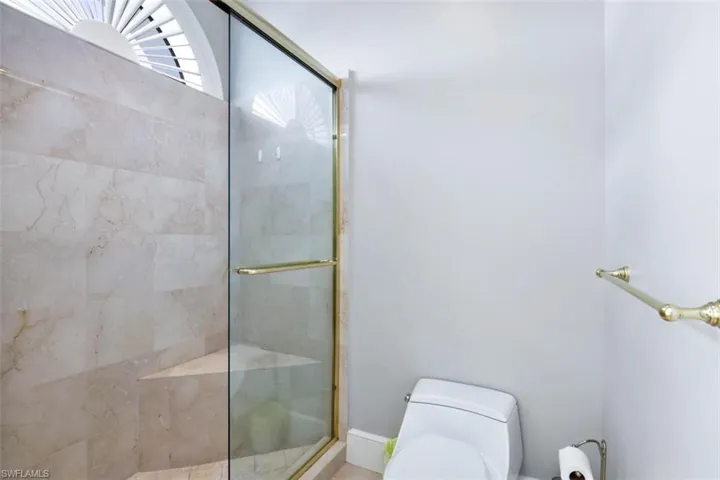 Bathroom with an enclosed shower and toilet