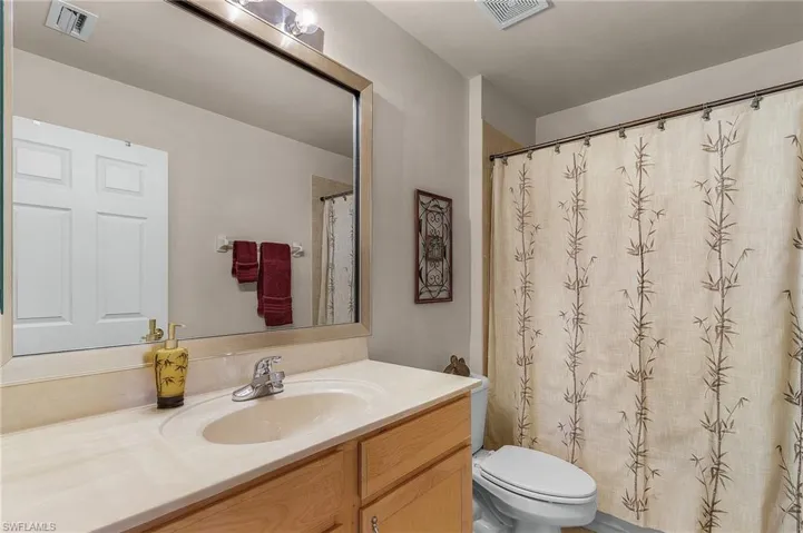 Bathroom featuring vanity and a shower with curtain