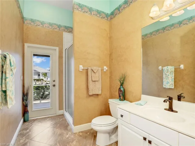 Bathroom with vanity and a stall shower
