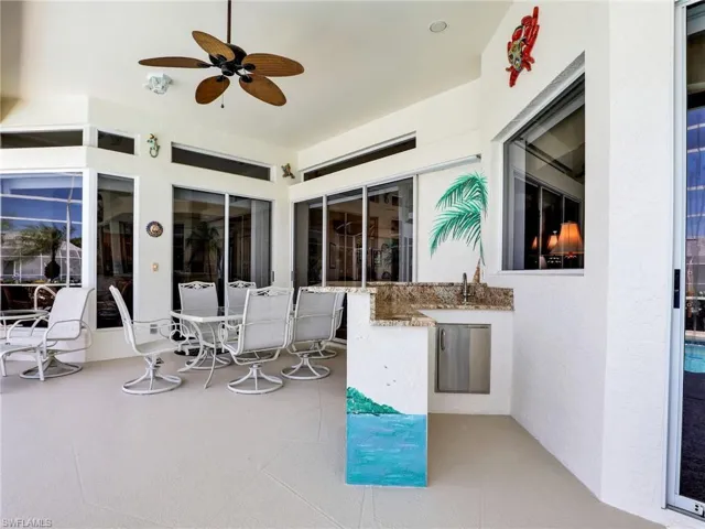 View of patio featuring a ceiling fan and outdoor dining space