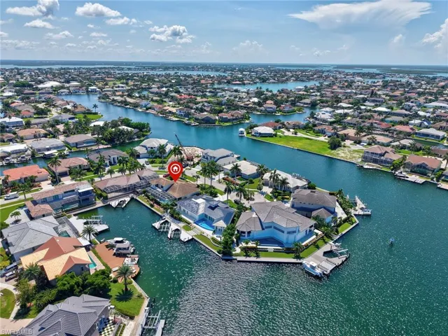 Aerial perspective of suburban area with a large body of water
