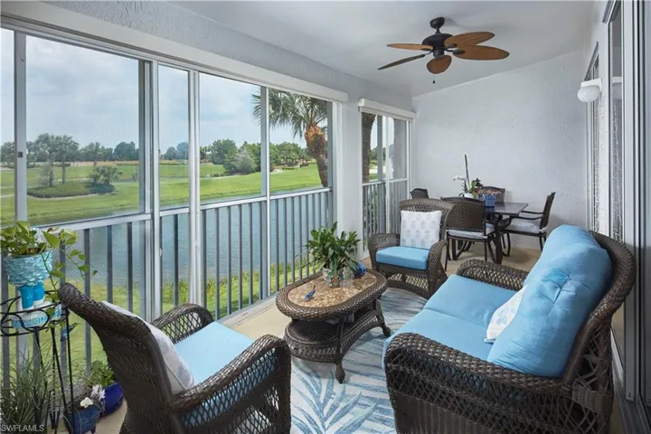 Sunroom featuring ceiling fan