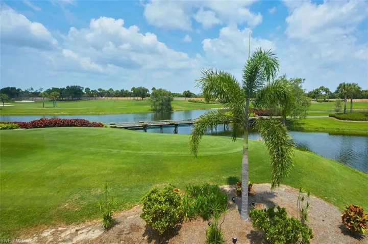 View of nearby features with a water view and a yard