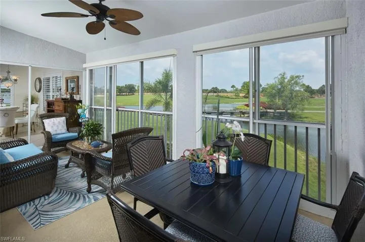 Sunroom / solarium featuring ceiling fan
