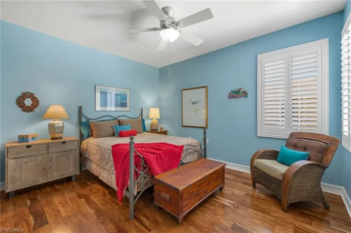 Bedroom featuring ceiling fan and wood-type flooring