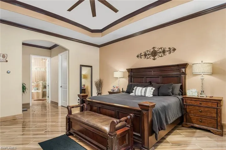 Bedroom featuring crown molding and ceiling fan
