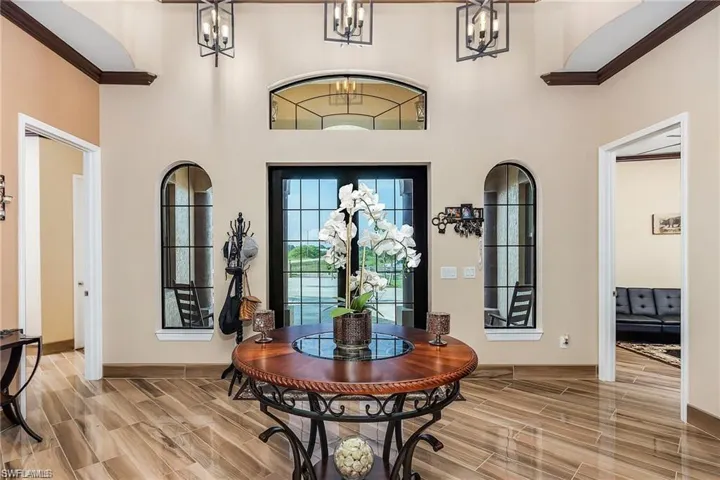 Entrance foyer with a towering ceiling and a chandelier