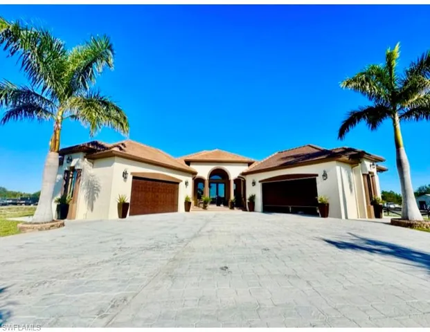 Mediterranean / spanish-style house featuring a garage