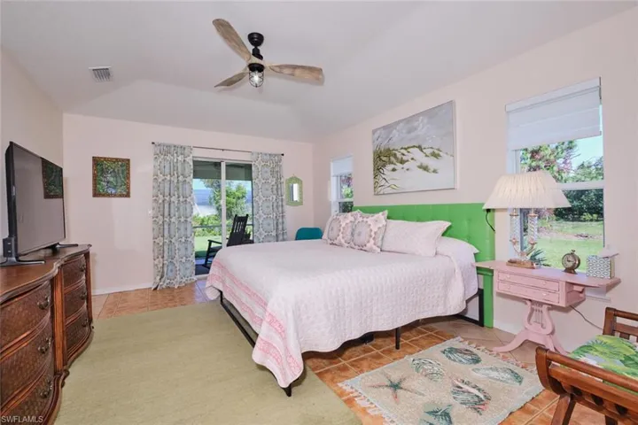 Master bedroom with sliding glass doors to the screened lanai.