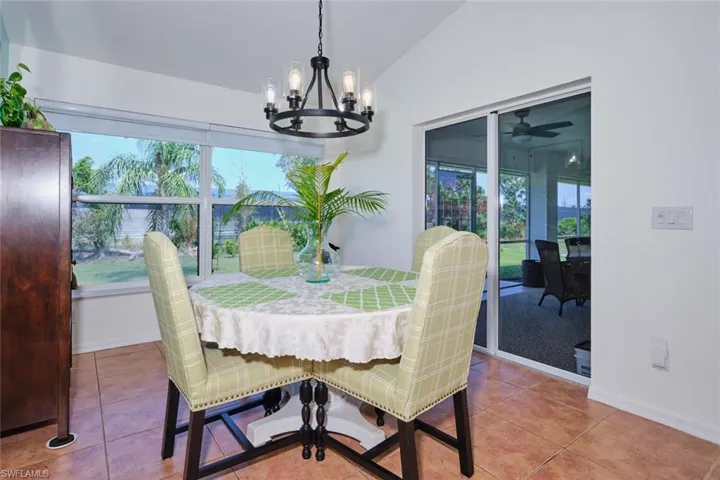 Dining area surrounded by windows and doors to catch the beautiful sunsets.