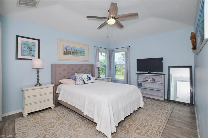 Guest bedroom with pocket sliding glass doors to the lanai.
