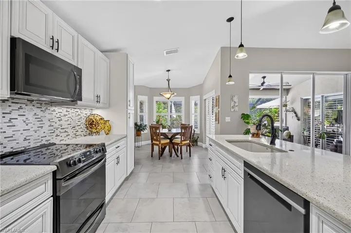 Open kitchen area with countertop island.