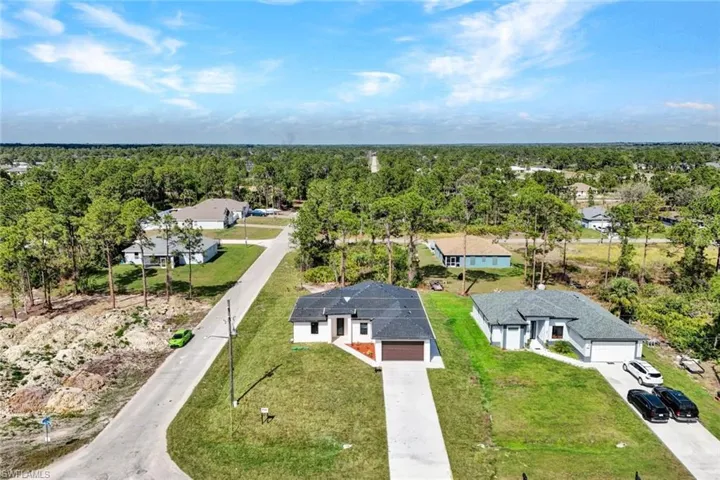 Drone / aerial view with a residential view and a forest view