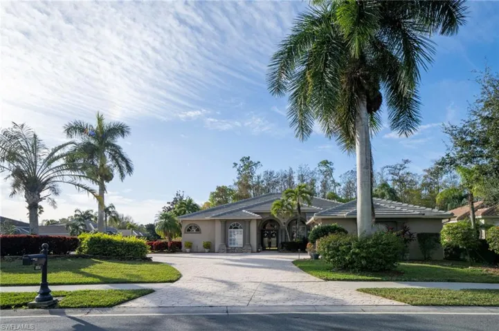 Ranch-style home with a front yard