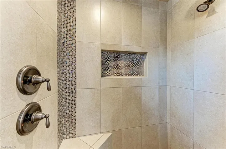 Bathroom view of a tile shower