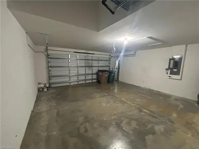 Garage featuring electric panel