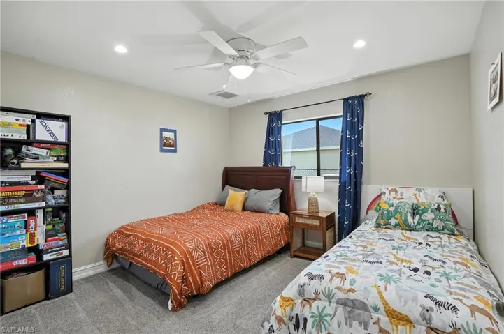 Bedroom with carpet, recessed lighting, and a ceiling fan