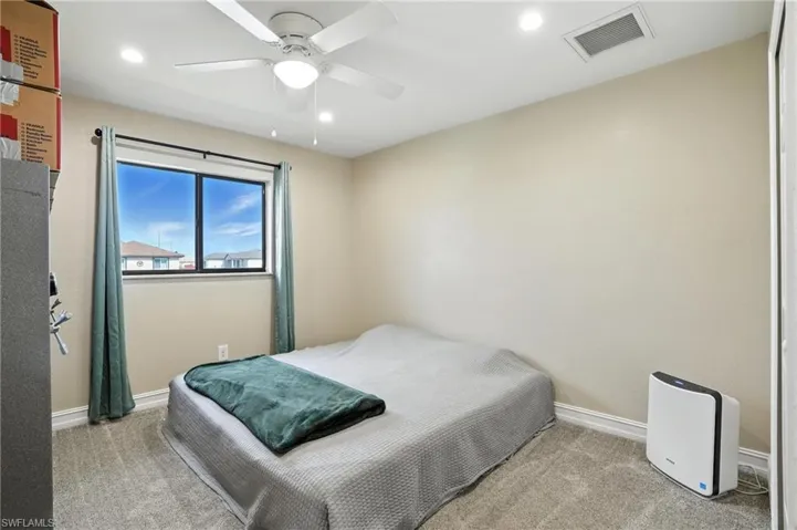 Bedroom featuring carpet, recessed lighting, and ceiling fan