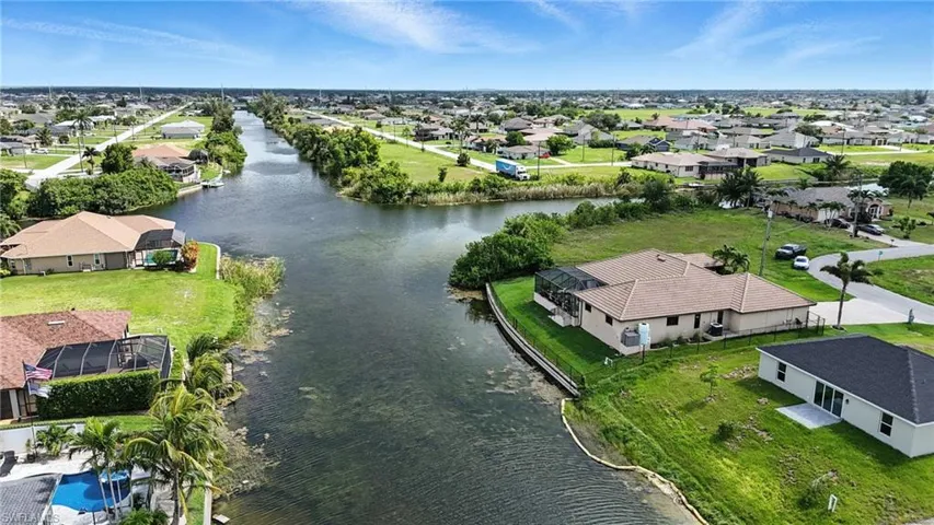 Aerial view of residential area with a large body of water