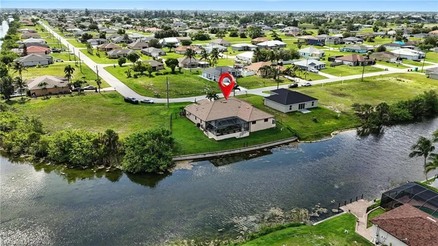 Aerial view of residential area with a large body of water