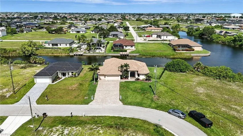 Aerial view of residential area with a large body of water