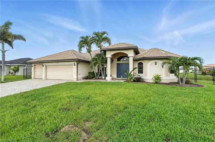 Mediterranean / spanish-style home featuring a garage, decorative driveway, stucco siding, and a tile roof