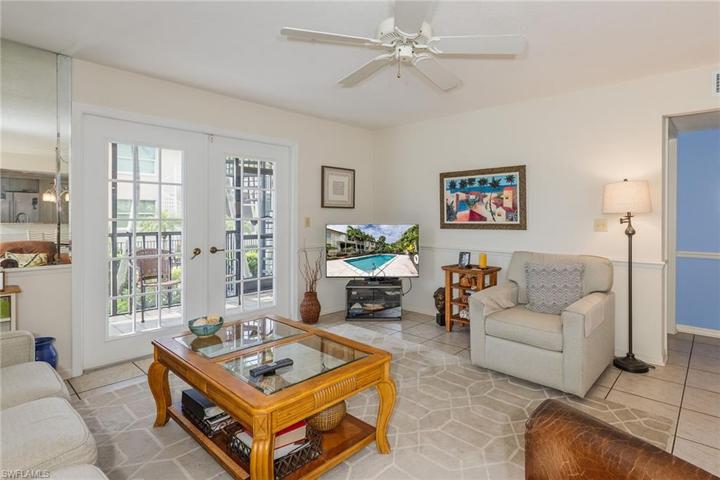 Living room looking out to screened porch