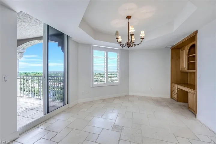 Den Off Kitchen w/ Sliders to East Balcony