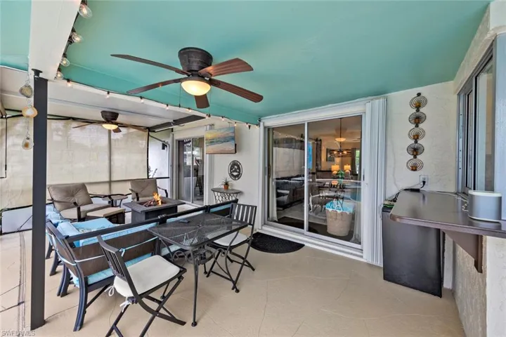 View of patio with an outdoor fire pit