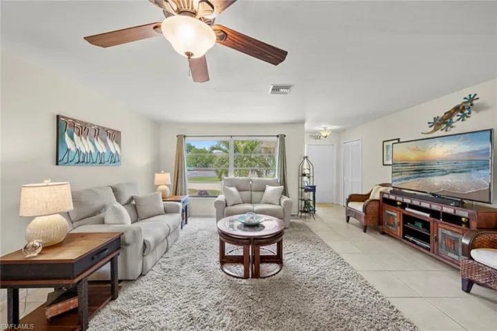 Tiled living room with ceiling fan