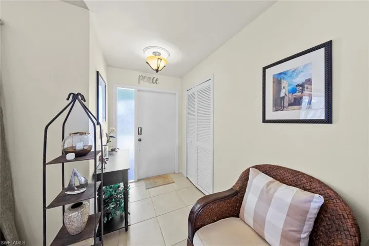 Entrance foyer featuring light tile patterned floors