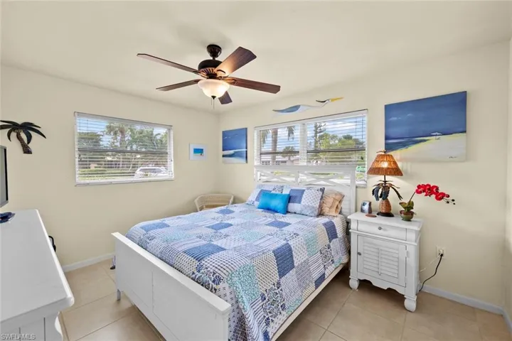 Tiled bedroom with ceiling fan