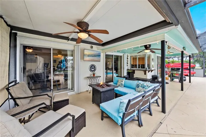 View of patio / terrace with an outdoor living space with a fire pit