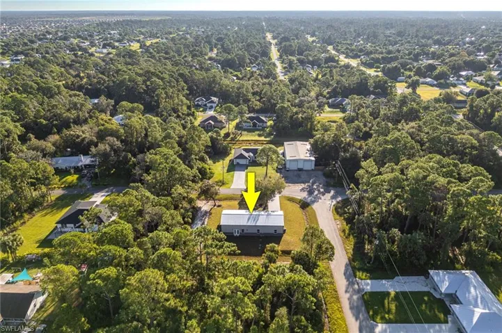 View of property location featuring a heavily wooded area