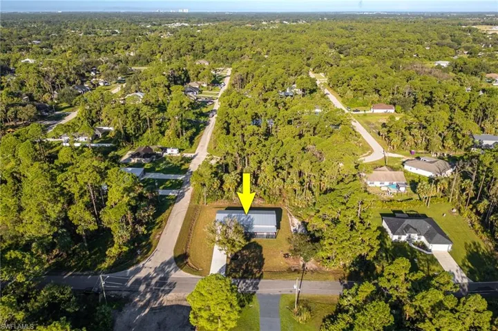 Aerial overview of property's location featuring a forest