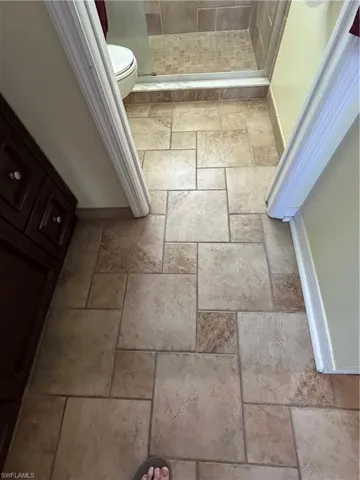 Bathroom featuring tiled flooring