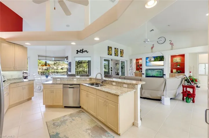 Casual dining nook with wraparound windows, pendant lighting, and views of the screened pool area. Enjoy your morning coffee while watching the wildlife from this room.