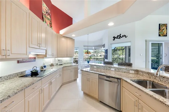 Well-designed kitchen with granite countertops, ample cabinetry, and clear sightlines to the main living areas. this is a chefs dream kitchen that has the perfect flow.
