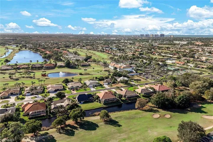 Aerial perspective showing the home’s proximity to open green space and surrounding neighborhood. Close to the front gate for quick access in and out of the community.