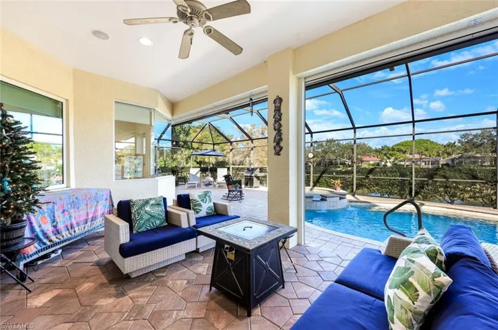 Screened-in pool with tranquil water views, paver decking, and a private outdoor setting. The perfect pool, spa and location for many relaxing days.