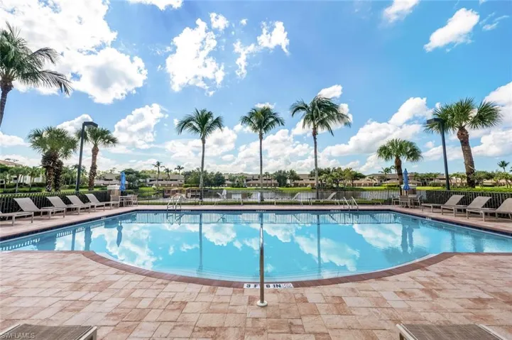 Community pool with a patio