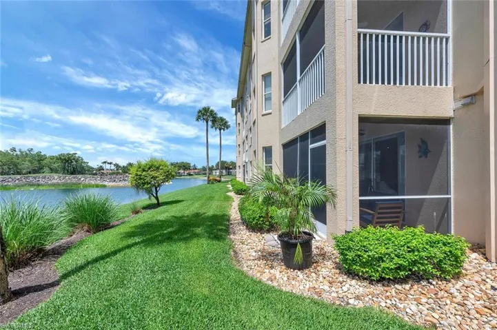 View of green lawn with a water view