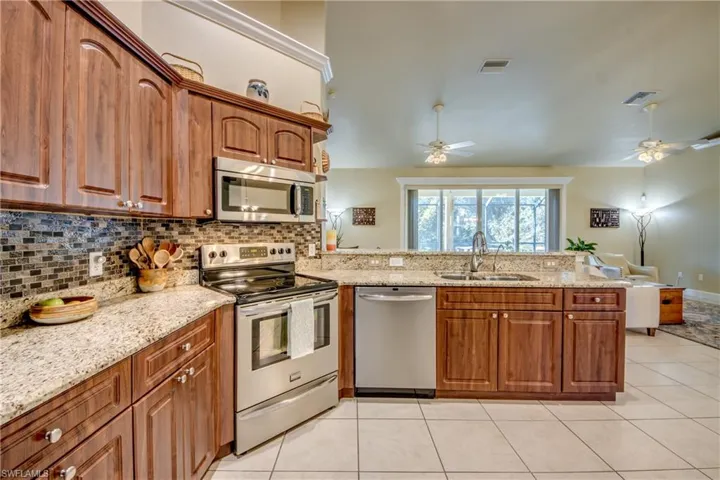 Kitchen w/ Stainless Steel Appliances & Granite