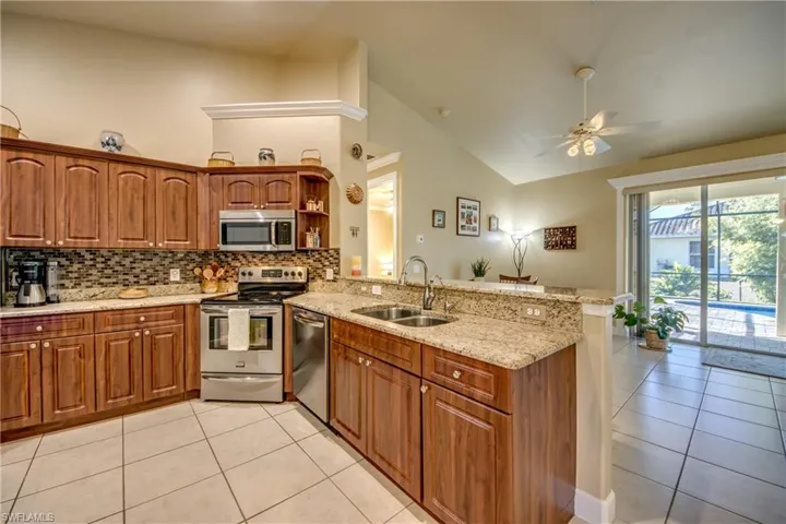 Kitchen w/ Stainless Steel Appliances & Granite