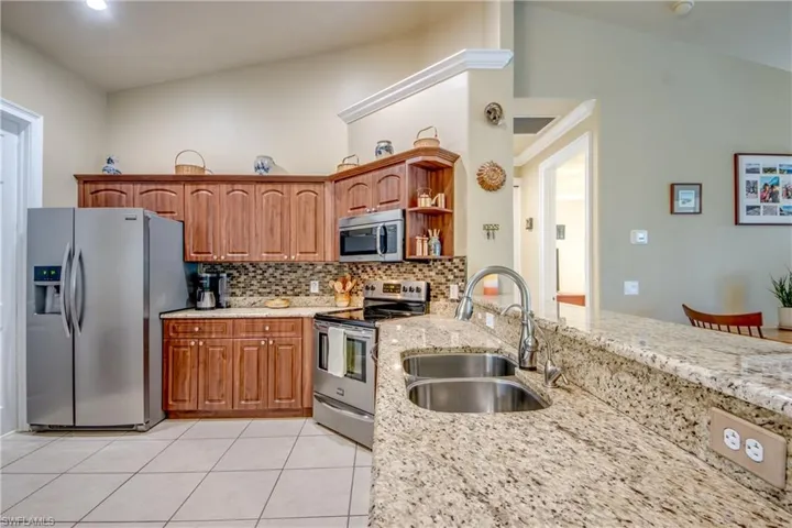 Kitchen w/ Stainless Steel Appliances & Granite