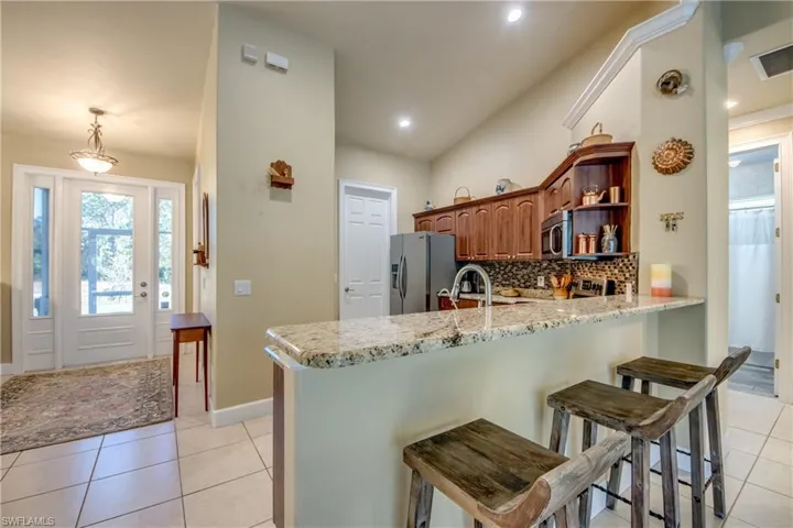 Kitchen w/ Stainless Steel Appliances & Granite