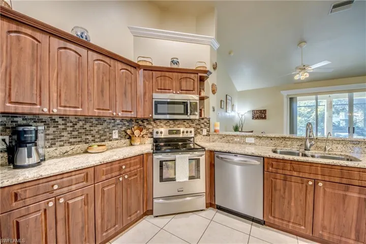 Kitchen w/ Stainless Steel Appliances & Granite