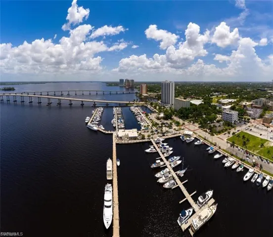View of urban area with a nearby body of water and a marina